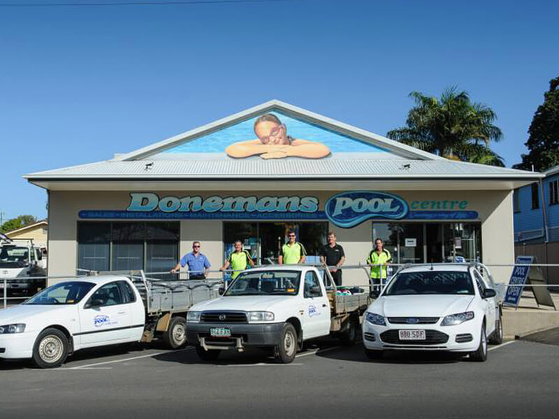 Donemans Pool Centre shop front and team photo